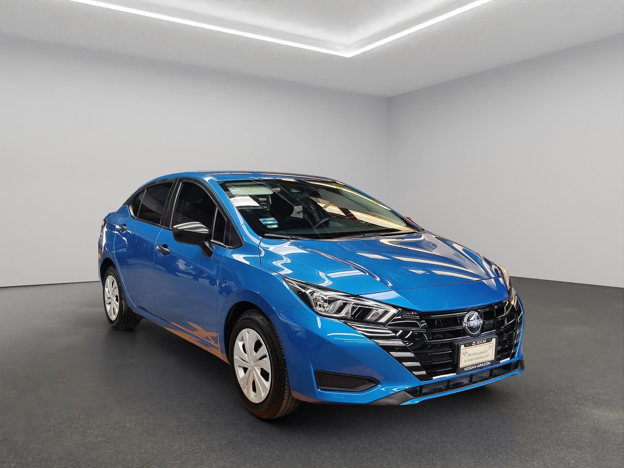 2024 Nissan Versa 4 pts. Sense, TM5, a/ac., R-15